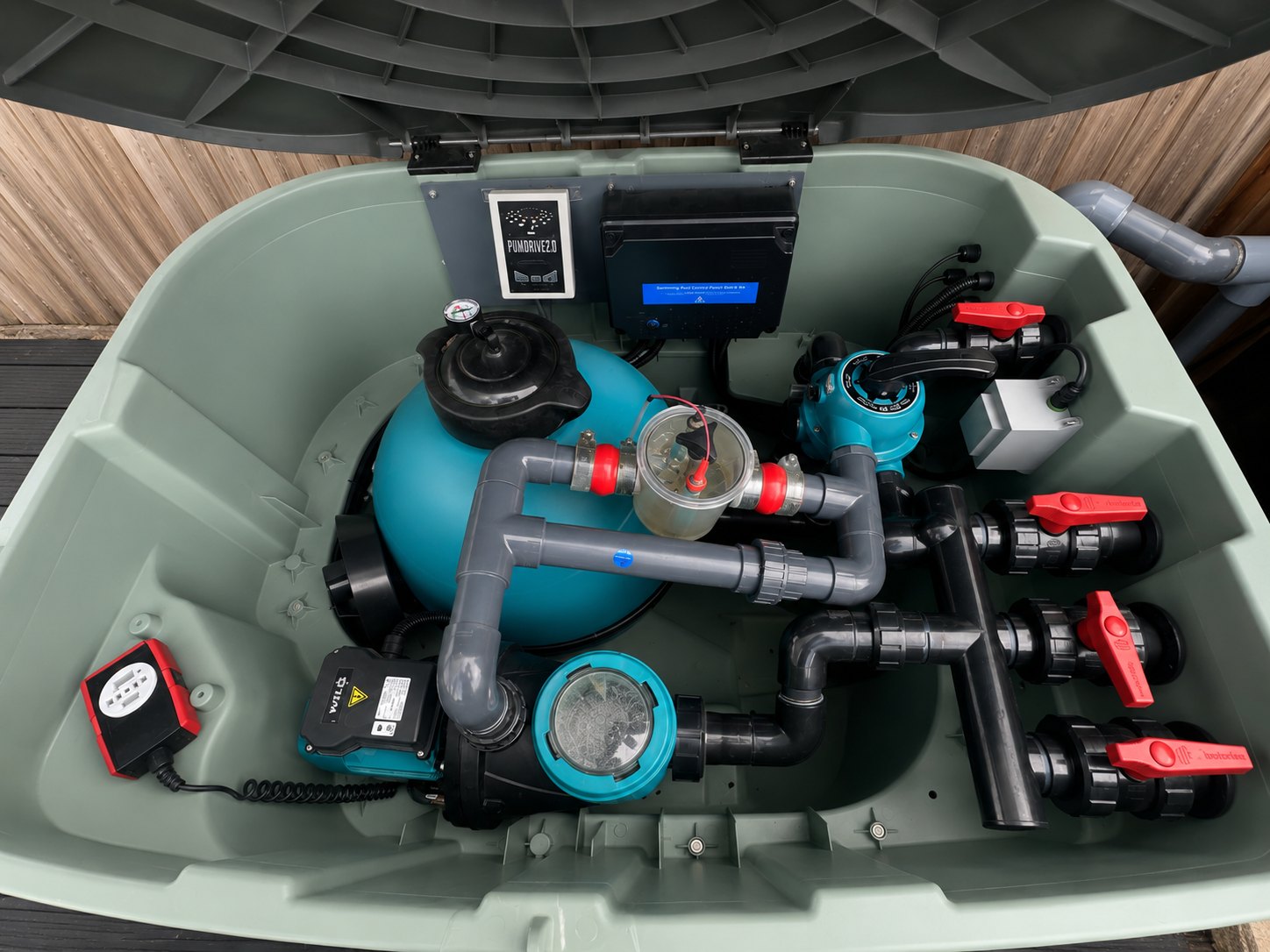 Compact pool tech box showing pump, filter and pipework